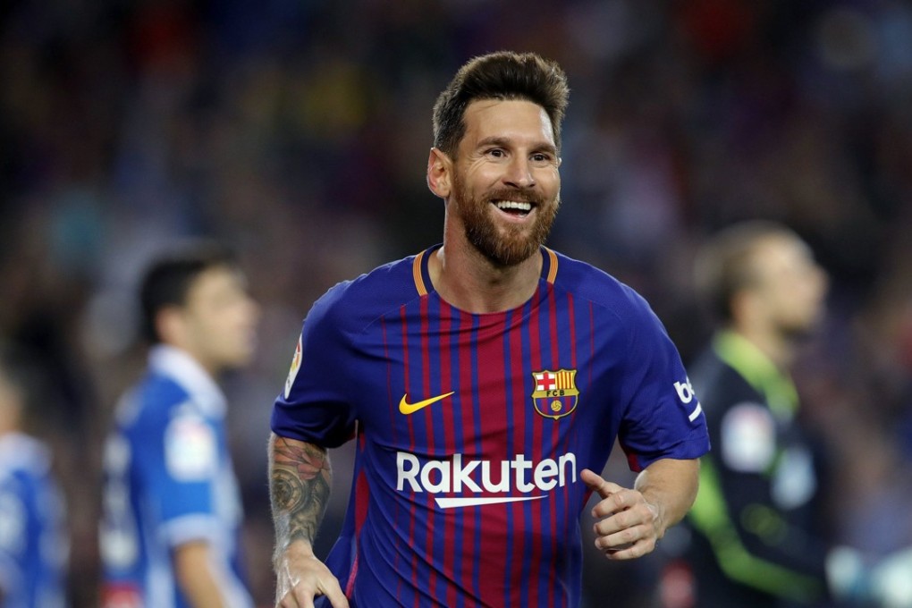Lionel Messi celebrates the first goal against Espanyol. Photo: EPA