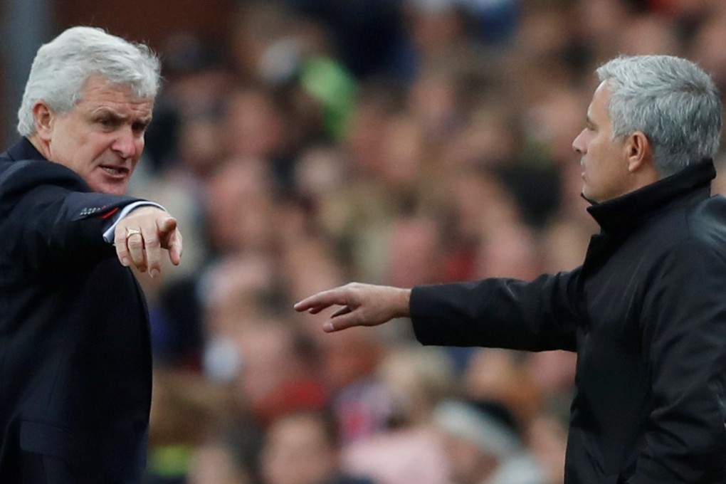 Mark Hughes and Manchester United manager Jose Mourinho were involved in a heated exchange on the touchline. Photo: Reuters