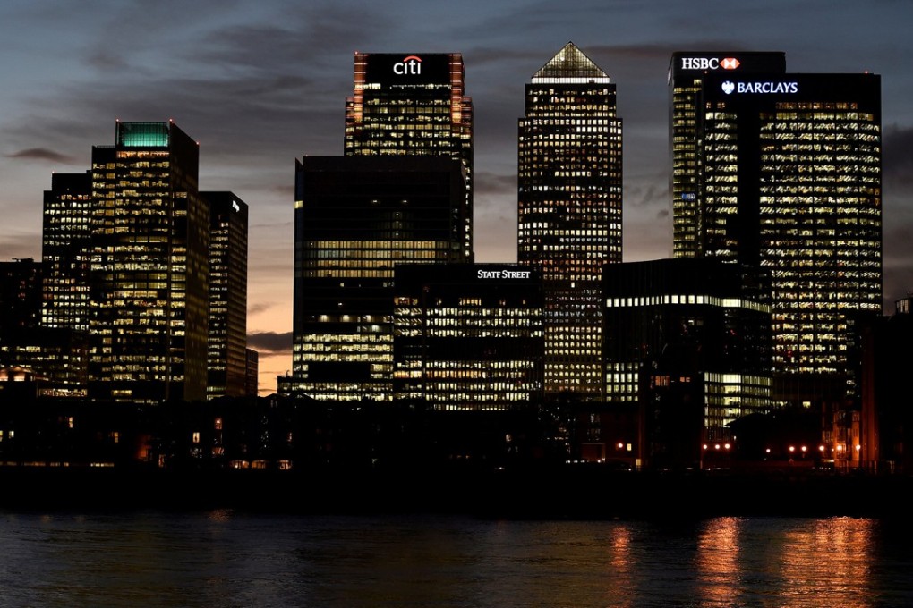 The Canary Wharf financial district at dusk in London, Britain. Photo: REUTERS/Toby Melville