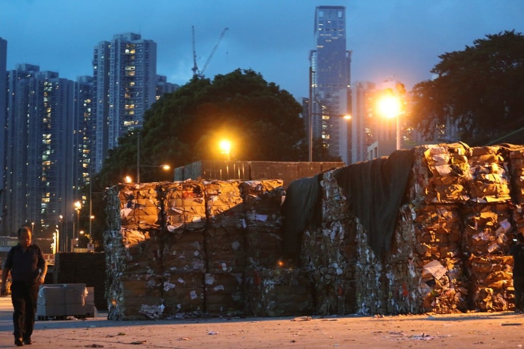 Stacks of waste paper are seen at bay in Tsuen Wan. These stacks aren’t going anywhere now that Beijing has moved to stop the import of such waste. Photo: Felix Wong