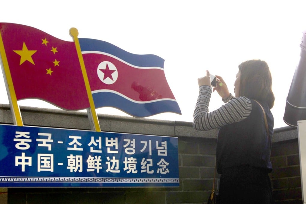 A visitor in Jilin province on the border with North Korea. Banks in the area are reportedly stopping North Koreans from sending remittances. Photo: AP