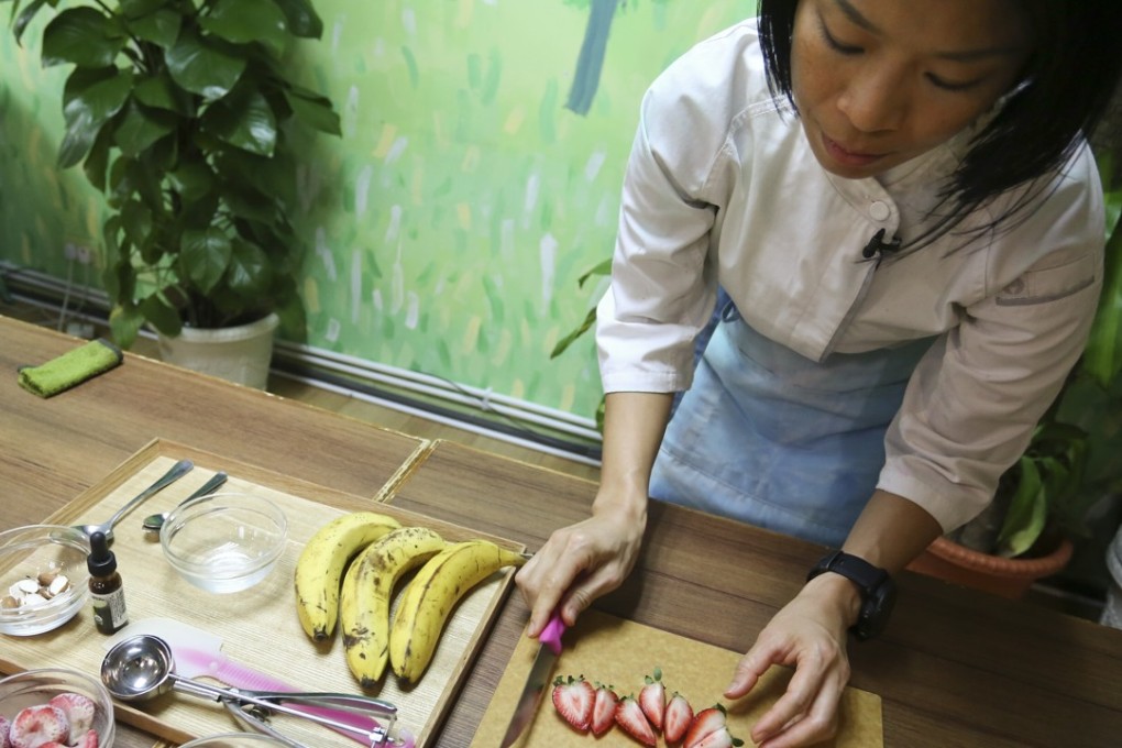 Iris Mak, a 41-year-old raw vegan marathon runner, shows how she fuels up for races at Greenwoods Raw Cafe in Tsim Sha Tsui. Photo: Jonathan Wong