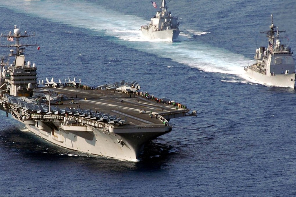 A file photo shows the aircraft carrier USS Abraham Lincoln and its support fleet. The carrier is headed to the Florida Keys as part of relief efforts. Photo: US Navy