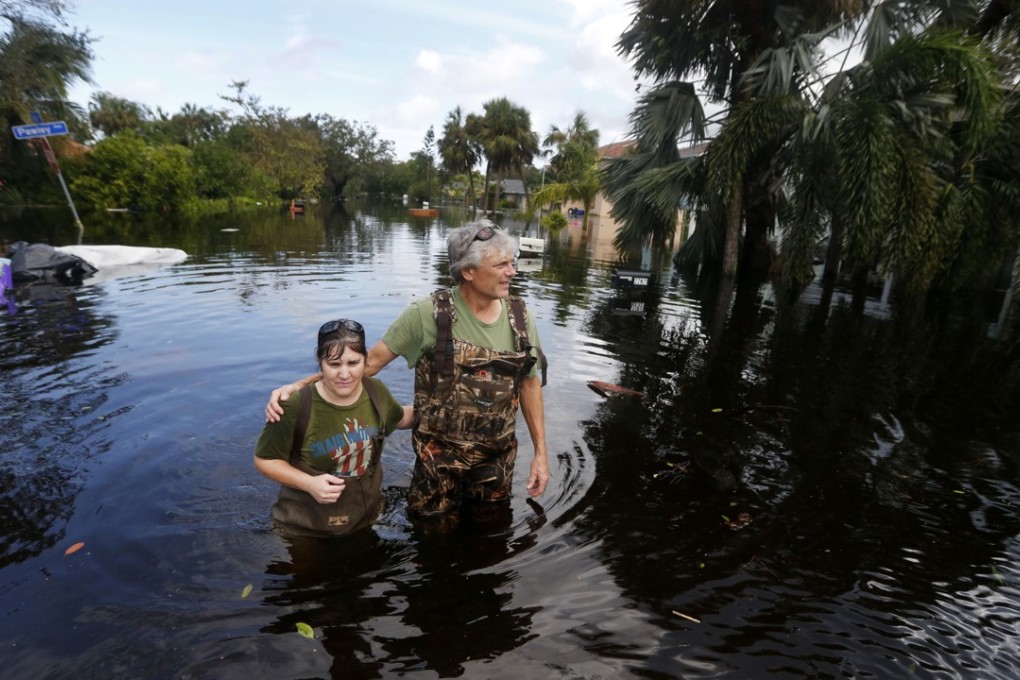 Kelly McClenthen returns to see the flood damage to her home with her boyfriend Daniel Harrison in the aftermath of Hurricane Irma in Bonita Springs, Florida, on Monday. Photo: AP