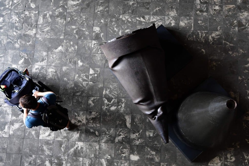 A man passes rocket heads at the entrance to the Technical Historical Museum in Peenemuende, northern Germany, on August 18, 2017. Photo: AFP