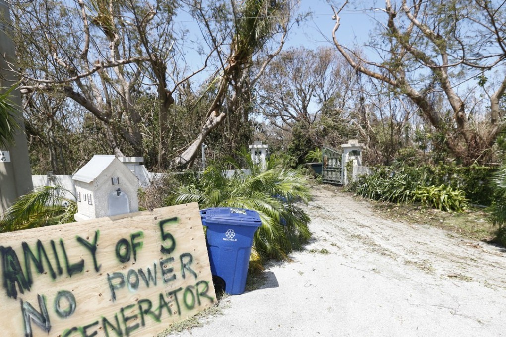 A sign outside a home where a family rode out Hurricane Irma is shown on Tuesday, September 12, 2017, in Key Largo, Florida, in the Florida Keys. Photo: AP