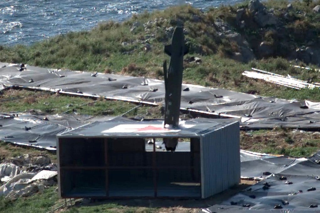 The Taurus missile, which was launched from a South Korean F-15K fighter jet, hits a target during a drill, off the country's western coast. Photo: AP
