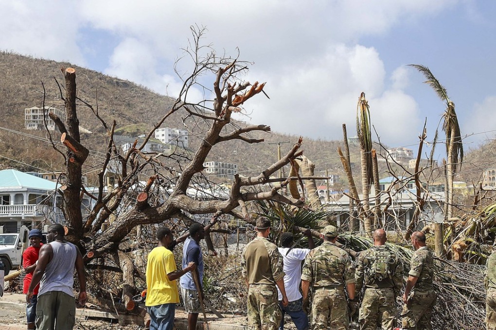 A handout picture provided by the British Ministry of Defence 12 September 2017 shows Army Commandos delivering aid and providing support to British Virgin Islands communities. Some 100 prisoners escaped during Hurricane Irma’s rampage in the Caribbean. Photo: Handout via EPA-EFE