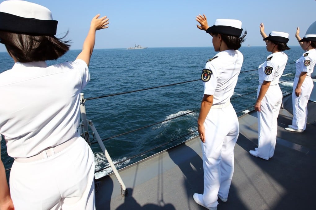Chinese officers wave goodbye to the Russian fleet at the end of a joint naval drill off Guangdong in September last year. Photo: Xinhua