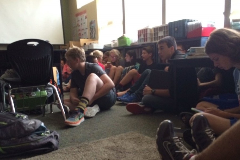 Evacuated Freeman High School students cower in a classroom in the adjacent elementary school in this photo taken by a student during Wednesday's shooting in Spokane, Washington. Photo: Twitter / Christina Morrison / @TheChristinaXX