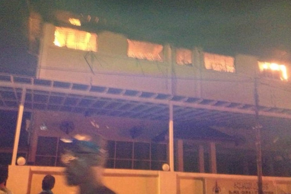Flames engulf the Tahfiz Darul Koran Ittifaqiyah school in Kuala Lumpur early Thursday. Photo: Twitter / Berita Harian Online