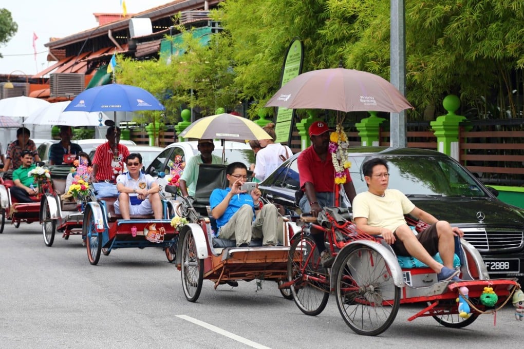 A trishaw taxi sightseeing tour in George Town, Penang. Pictures: Alamy