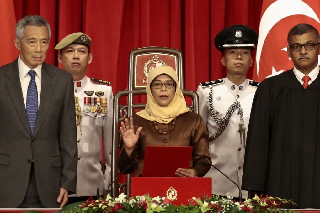 President-elect Halimah Yacob takes the oath of office. Photo: EPA