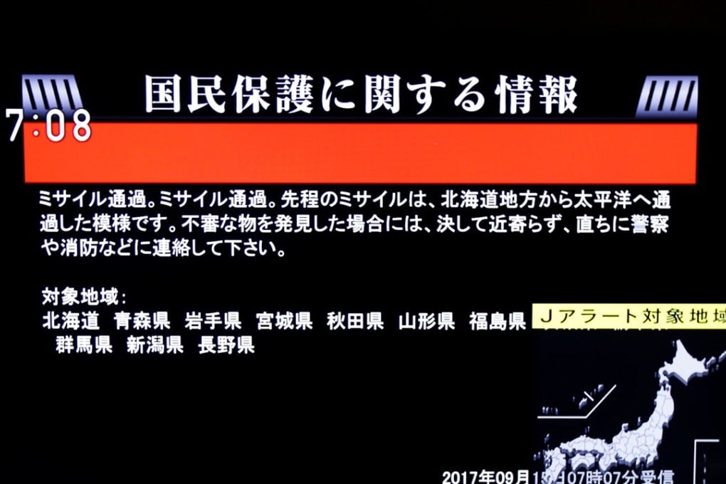 The Japanese government's alert message called J-alert, notifying citizens of a ballistic missile launch by North Korea, is seen on a television screen in Tokyo. Photo: Reuters