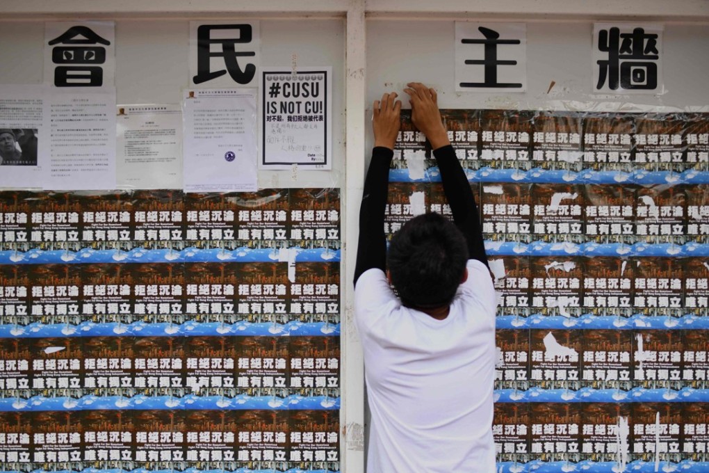 Posters advocating Hong Kong independence are put up on Chinese University’s “democracy wall”, on September 7. Photo: AFP