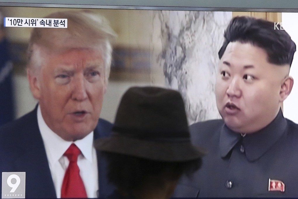 President Donald Trump and North Korean leader Kim Jong-un feature in a news programme being telecast at the Seoul Train Station on August 10. Photo: AP