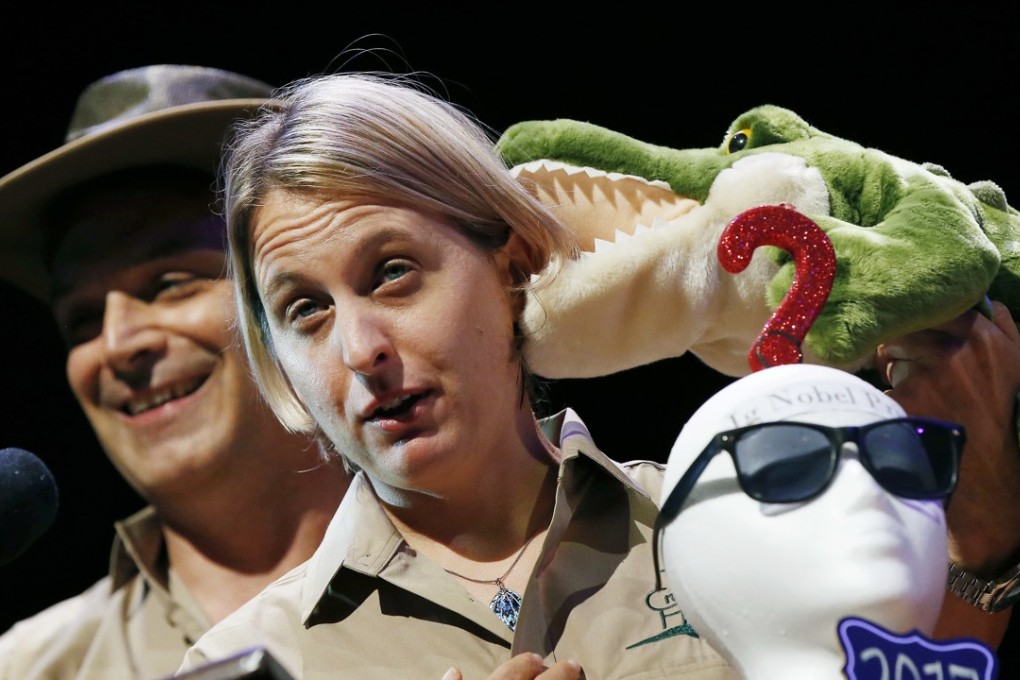 Matthew Rockloff and Nancy Greer give their acceptance speech after winning the Ig Nobel Economics Prize at Harvard University in Cambridge, Massachusetts on Thursday. The pair won for their experiments to see how contact with a live crocodile affects a person's willingness to gamble. Photo: AP