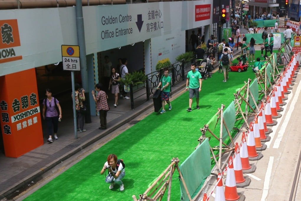 Visitors enjoy public space on Des Veoux Road Central during a trial initiative to pedestrianise the arterial road in Hong Kong’s business district, last September 25. Photo: David Wong