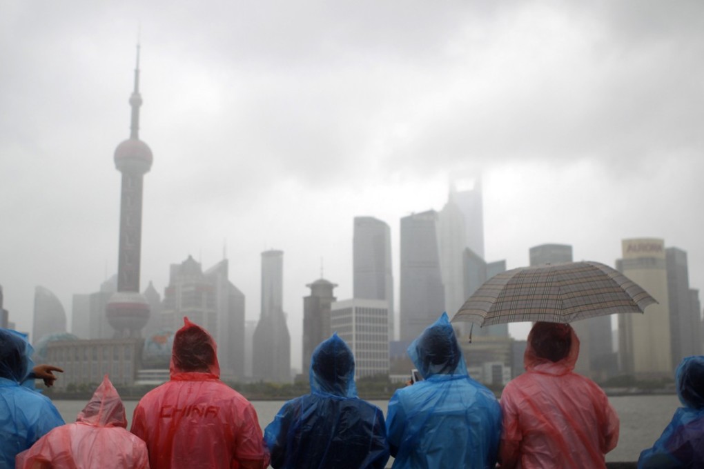 Tourists visit the Bund, Shanghai. Photo: AP
