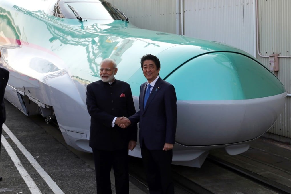 Indian PM Narendra Modi and Japanese counterpart Shinzo Abe in front of an E5 series Shinkansen bullet train. Photo: Bloomberg