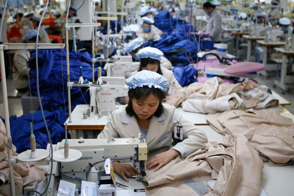 This file photo shows North Korean women working in a factory owned by a South Korean firm in Kaesong, just a few hundred metres north of the Demilitarised Zone. Forced labour is just one of the ways Pyongyang is alleged to make money for the reclusive state. Photo: AFP