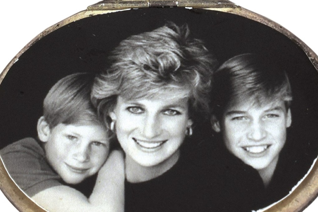 A locket containing a photograph of Princess Diana and her sons Prince Harry, left, and Prince William, " that is among dozens of items with a direct connection to the princess that were sold at auction by Boston-based RR Auction. Photo: RR Auction via AP