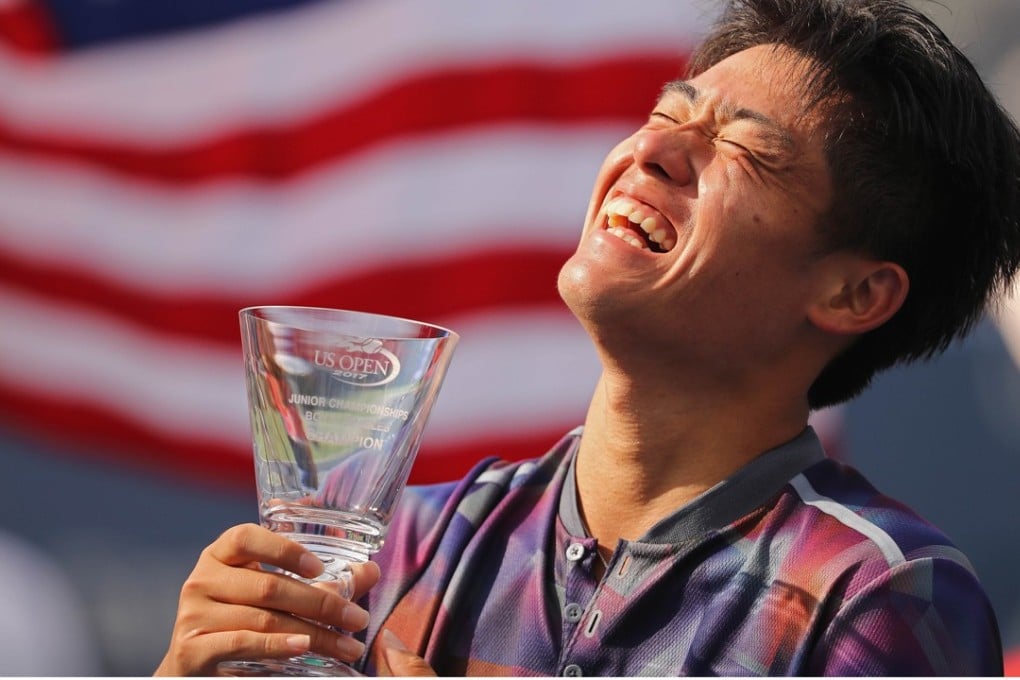 Wu Yibing with the championship trophy after defeating Axel Geller of Argentina in their Junior Boys' Singles final at the US Open. Photo: AFP