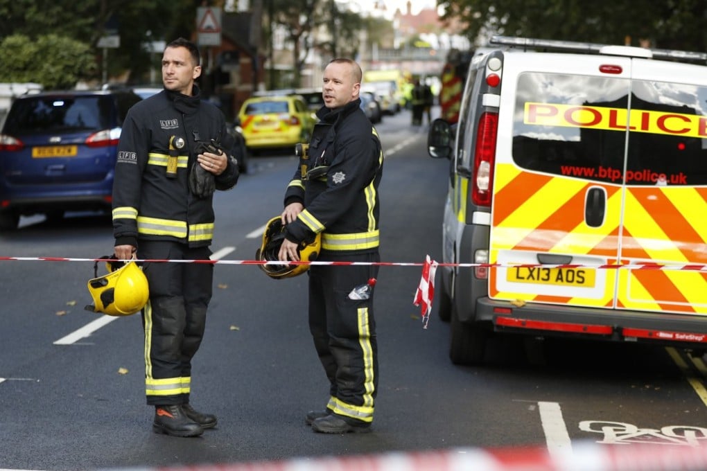 Fire Brigade officers stand inside a cordon near where an incident happened, that police say they are investigating as a terrorist attack, at Parsons Green subway station in London, Friday, September 15, 2017. Photo: AP