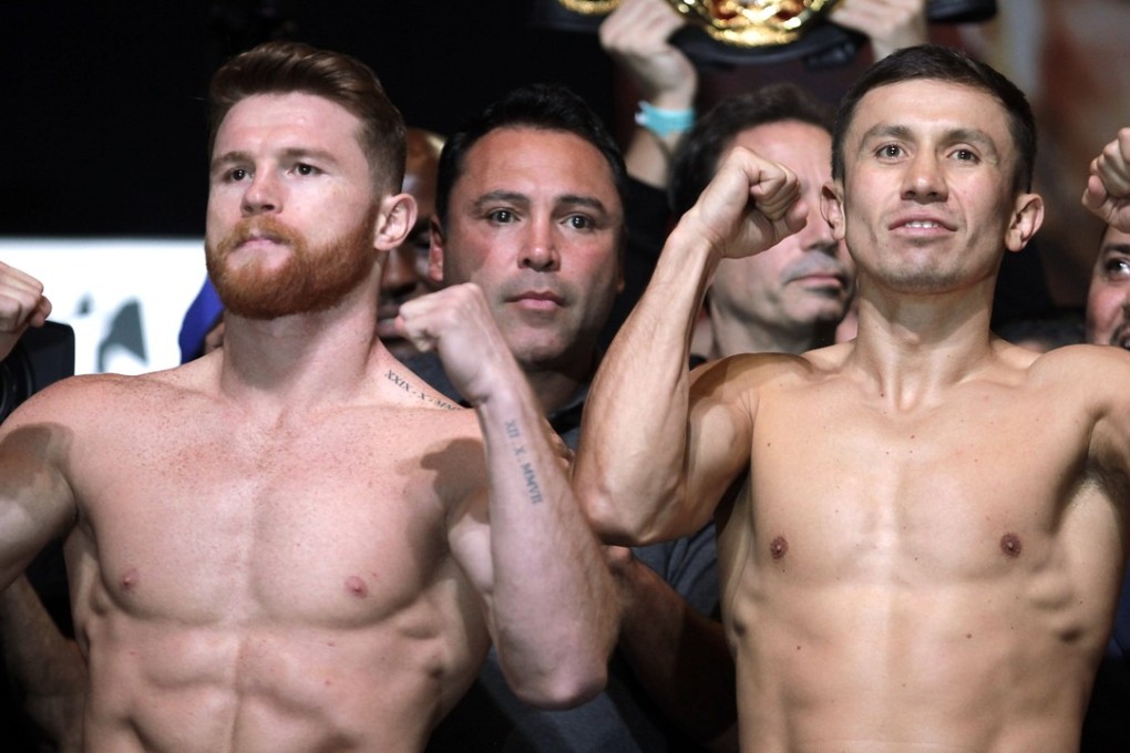 Boxers Canelo Alvarez (L) and Gennady Golovkin (R) pose during their weigh-in at the MGM Grand Hotel & Casino on September 15, 2017 in Las Vegas, Nevada. Alvarez will challenge WBC, WBA and IBF middleweight champion Gennady Golovkin for his titles at T-Mobile Arena on September 16 in Las Vegas. / AFP PHOTO / John GURZINSKI