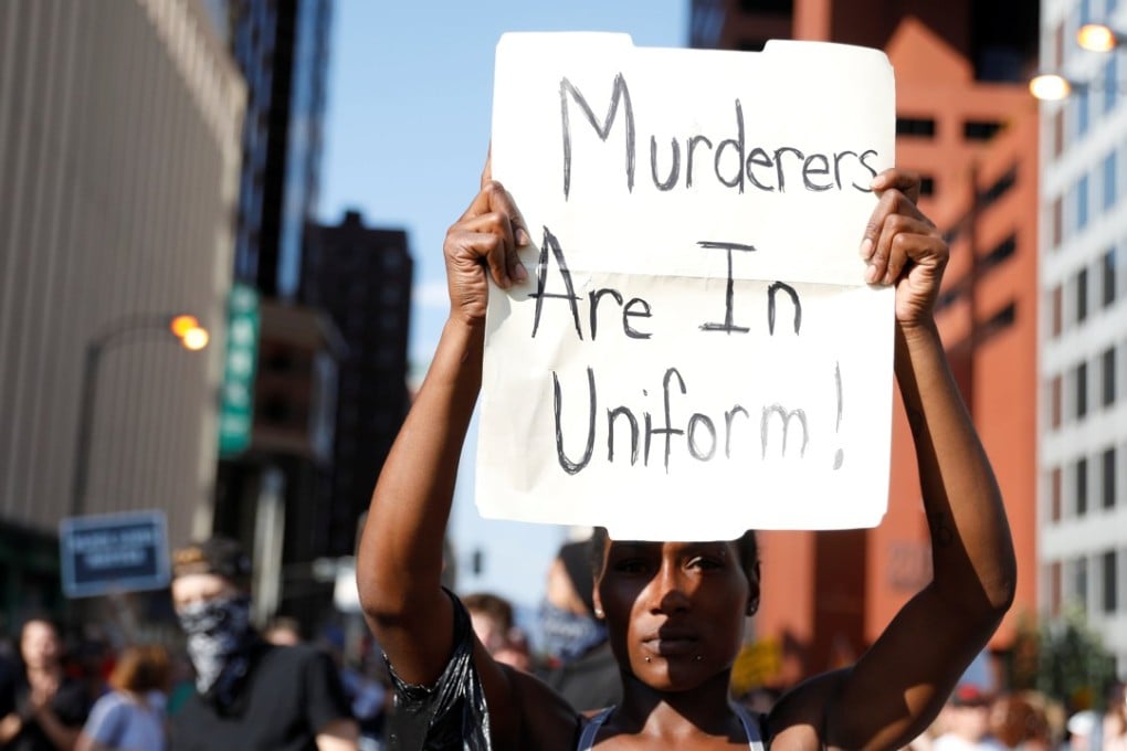 A woman marches downtown after the not guilty verdict was announced in the murder trial of Jason Stockley. Photo: Reuters