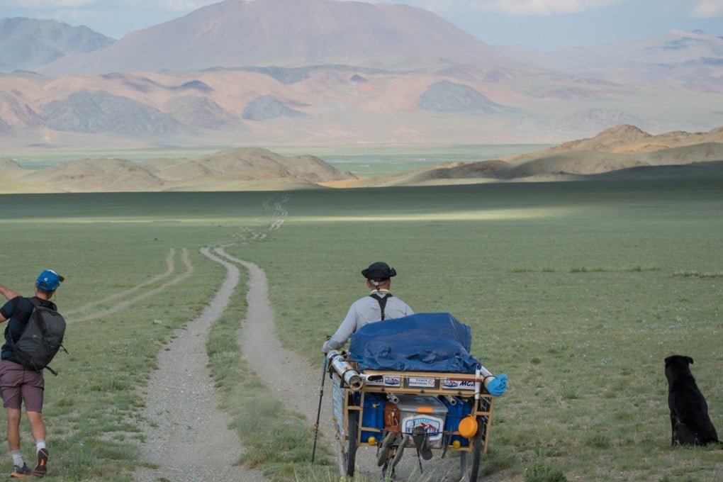 Adam Rolston hits one of over 20,000 strokes as he and caddie Ron Rutland golf across Mongolia. Photo: Andrew King