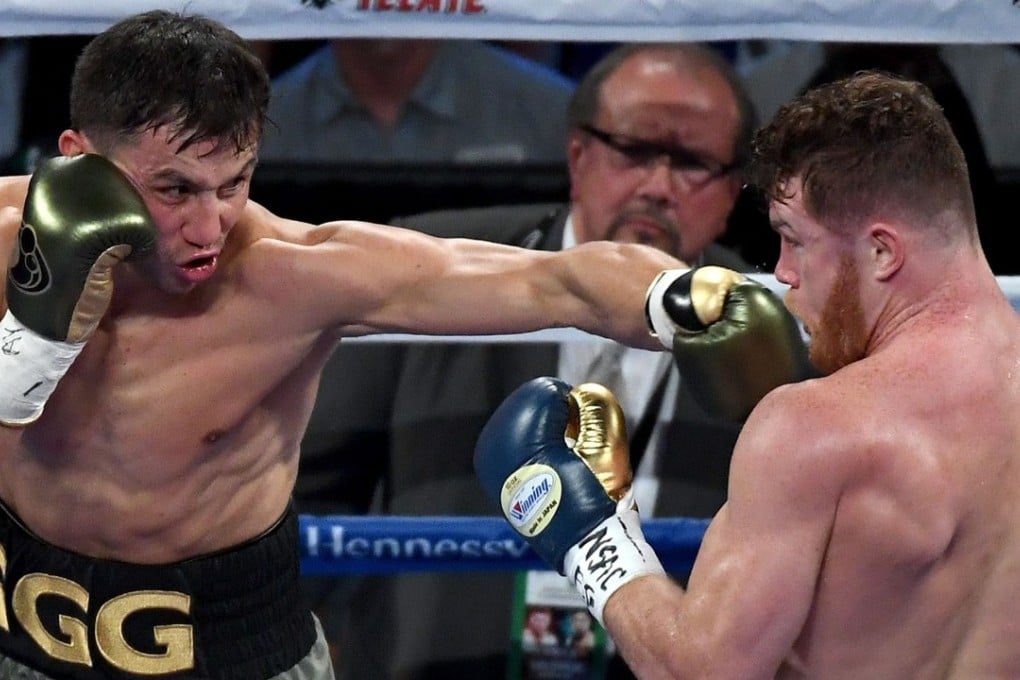Gennady Golovkin swings at Canelo Alvarez as the middleweight showdown lives up to its hype. Photo: AFP