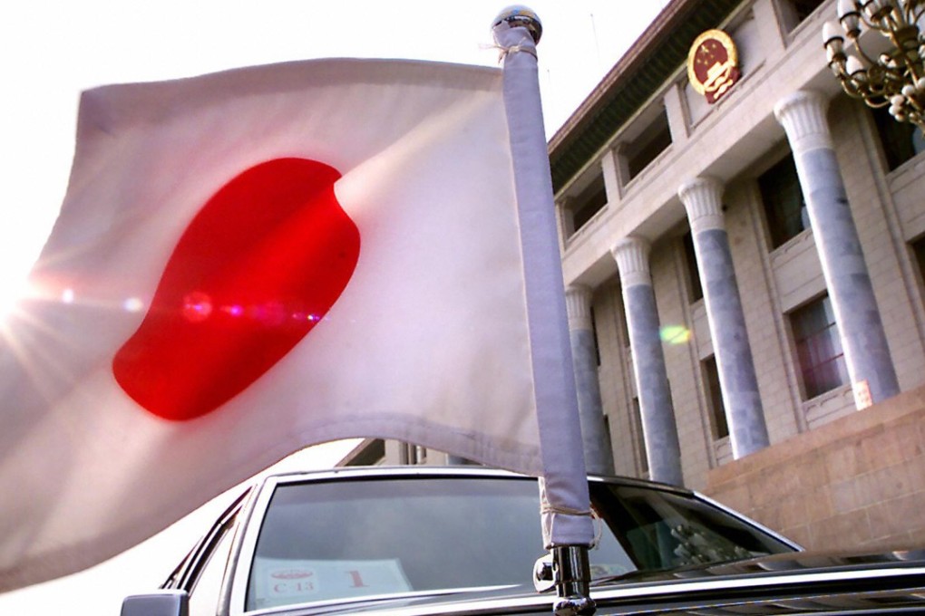 A limousine flies the Japanese flag in this file photograph. A Japanese national has been arrested in northeastern China on suspicion of spying. Photo: AFP
