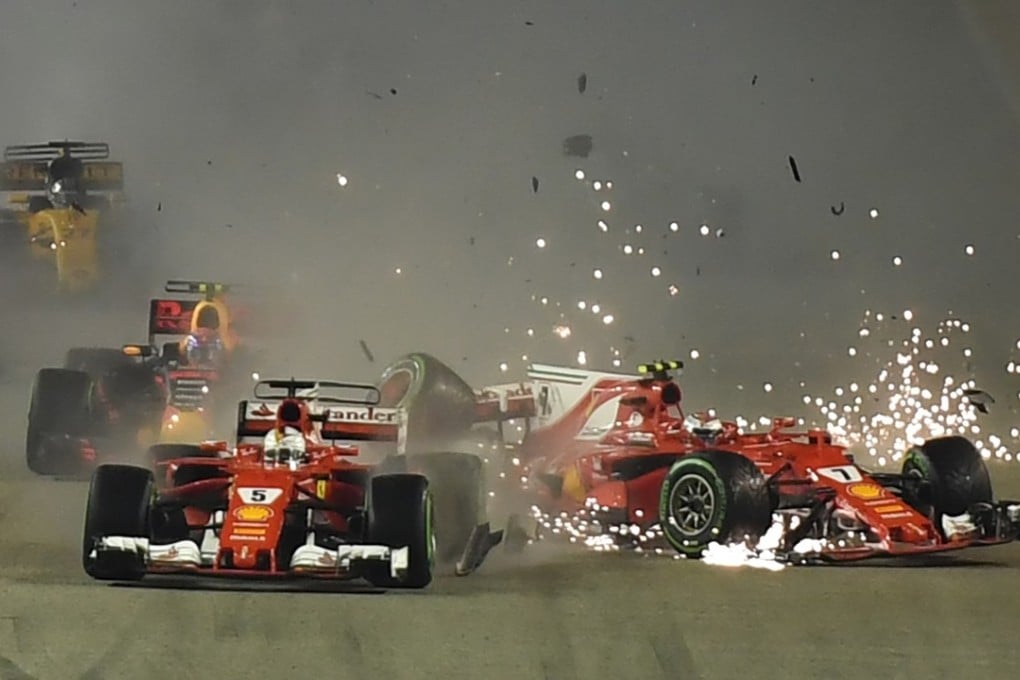 Ferraris collide during the Formula One Singapore Grand Prix. Photo: AFP