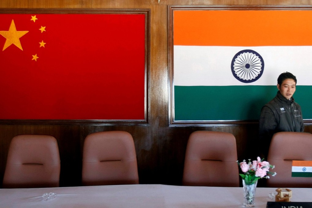A man walks through a conference room used for meetings between military commanders of China and India, at the Indian side of the Indo-China border at Bumla, in the northeastern Indian state of Arunachal Pradesh, in 2009. Photo: AFP