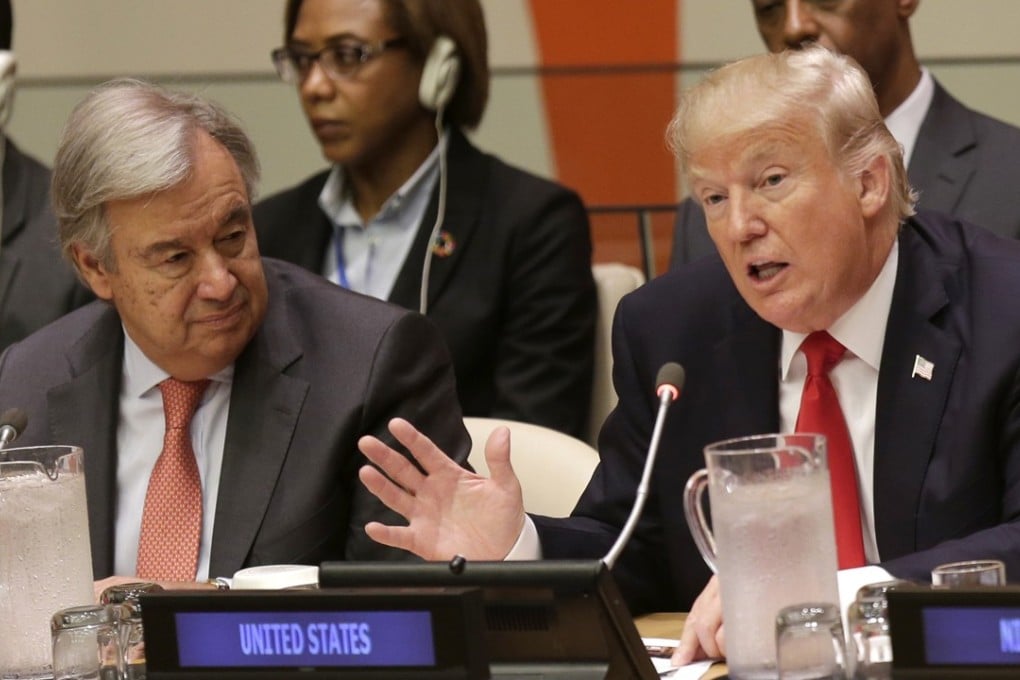 US President Donald Trump (right) speaks while UN Secretary-General Antonio Guterres listens at a meeting during the United Nations General Assembly on Monday. Photo: AP
