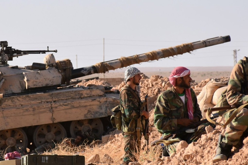 Syrian pro-government forces hold a position near the village of al-Maleha, in the northern countryside of Deir Ezzor. Photo: AFP