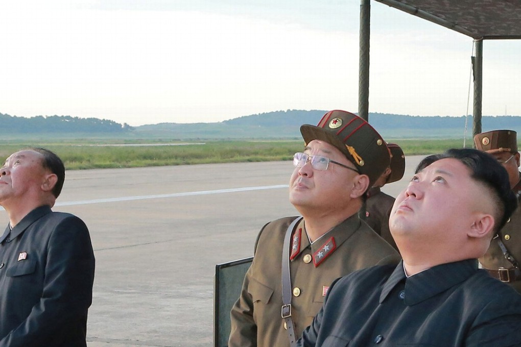 North Korean leader Kim Jong-un (right) pictured watching the launch of a Hwasong-12 missile in a photograph released by North Korean state media earlier this month. Photo: Reuters
