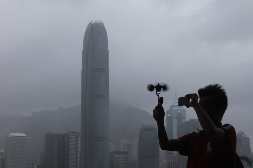 Someone hecking the wind speed at Victoria Harbour in Tsim Sha Tsui as Typhoon Pakhar nears Hong Kong. Photo: Felix Wong