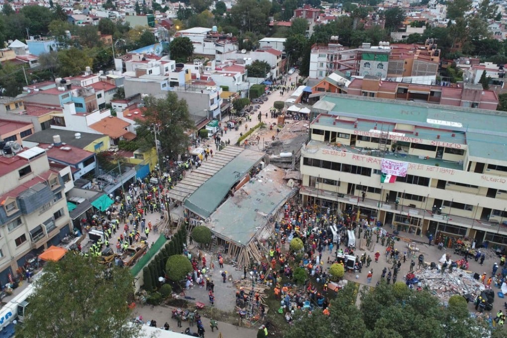 Mexican rescue teams look for people trapped in the rubble at the Enrique Rebsamen elementary school in Mexico City on Wednesday. Photo: AFP