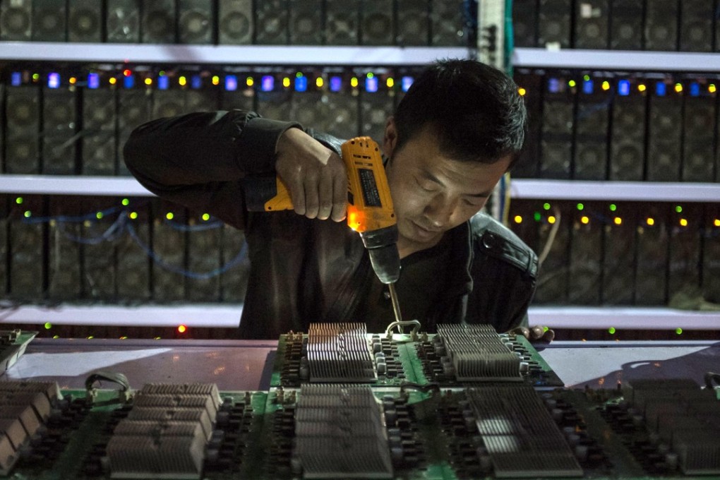 Nearly 70 per cent of all new bitcoin are mined in China in warehouses where massive numbers of microprocessors are used to solve complex maths problems, rewarding miners with the digital currency. Photo: EPA