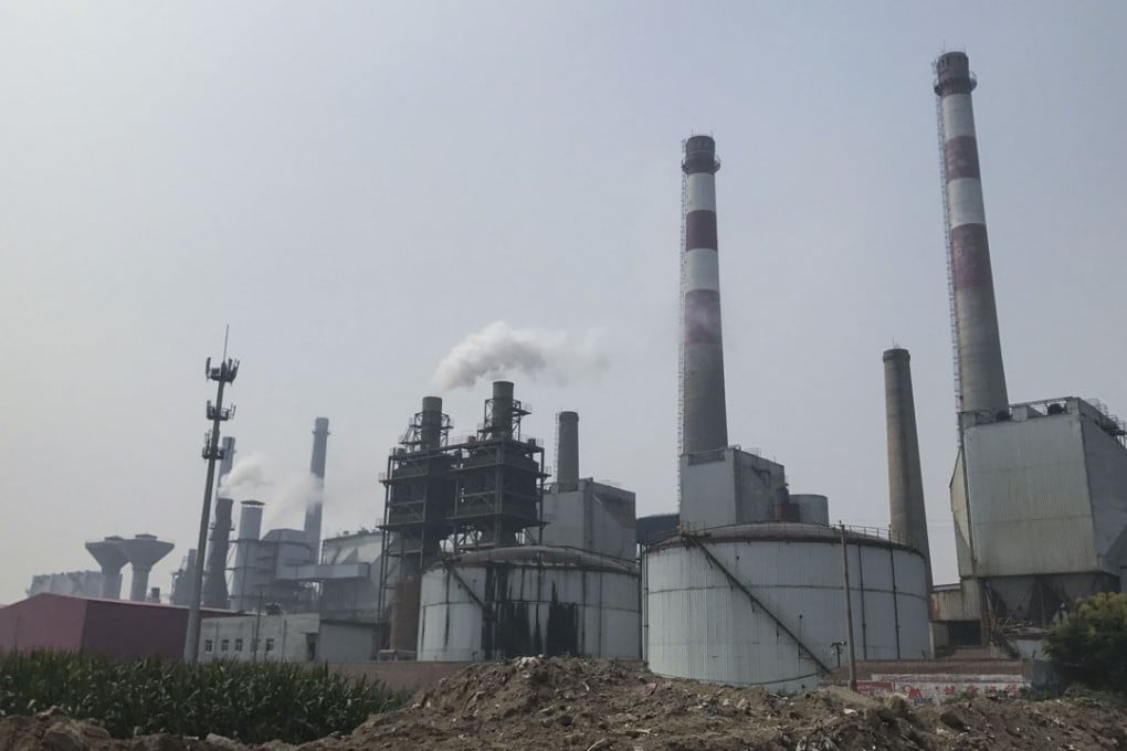 Chimneys at a glass factory in Shahe, Hebei, emit plumes of sour-smelling steam on September 12. Photo: Viola Zhou