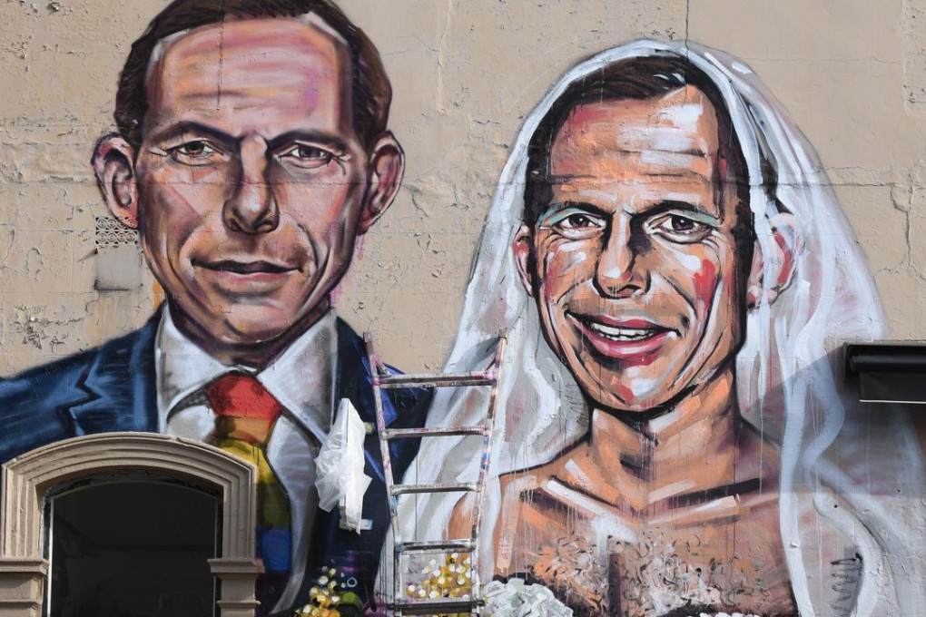 A mural is Sydney showing former Australian prime minister Tony Abbott getting married to himself. Photo: EPA