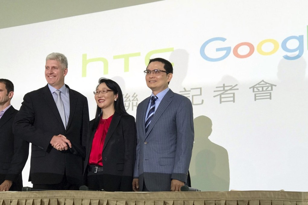 Rick Osterloh, senior vice-president of hardware for Google (second from left), and Cher Wang, chairwoman of HTC, announce a US$1.1 billion deal for Google to take on HTC engineering staff. Photo: AP