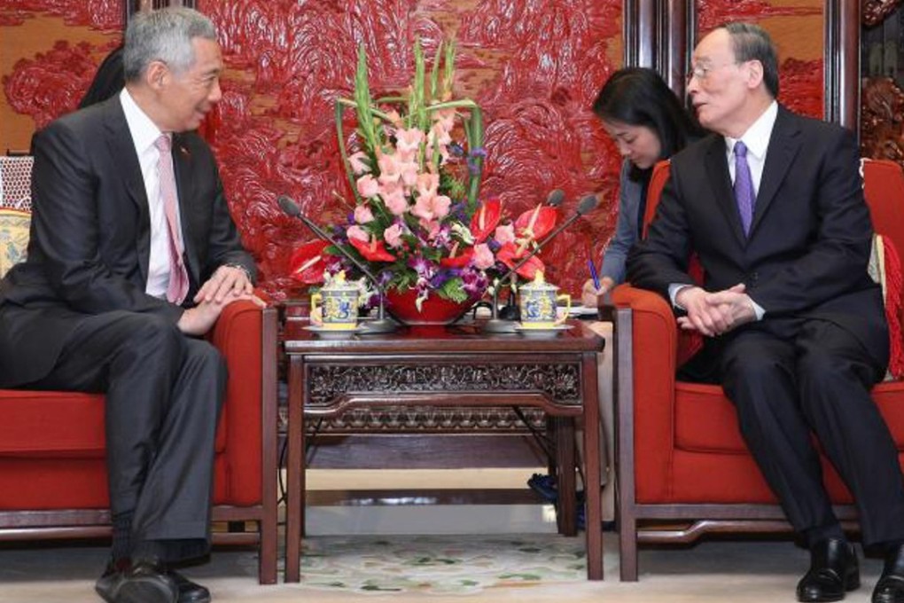 Singapore’s Prime Minister Lee Hsien Loong (left) meets Wang Qishan in Beijing on Wednesday. Photo: Handout