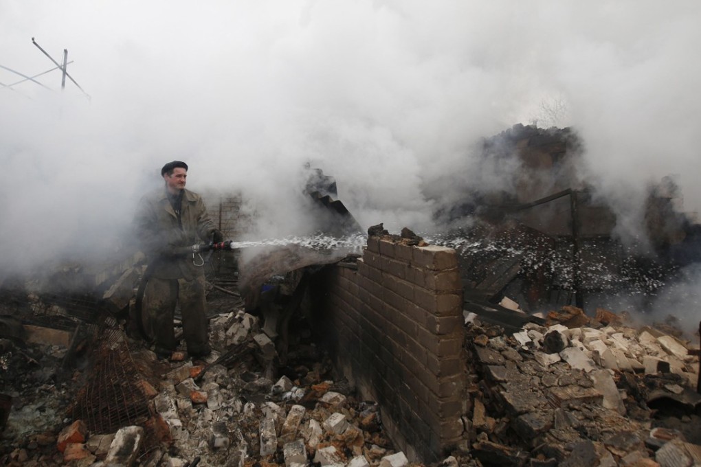 The aftermath of shelling by pro-Russian rebels in the east of Ukraine. Despite the ongoing conflict, Ukraine managed to raise US$3bn in a dollar-denominated bond sale that was three times oversubscribed. Photo: AFP