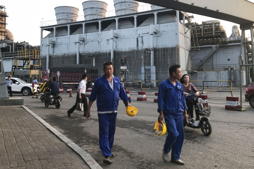Steel workers leave the Handan Iron and Steel factory at the end of their shift on September 13. Photo: Viola Zhou