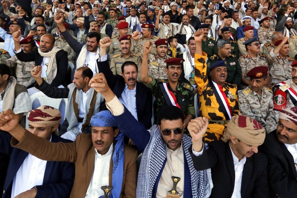 Houthi supporters shout slogans during a rally commemorating the third anniversary of the Houthis’ capture of the Yemeni capital. Photo: EPA