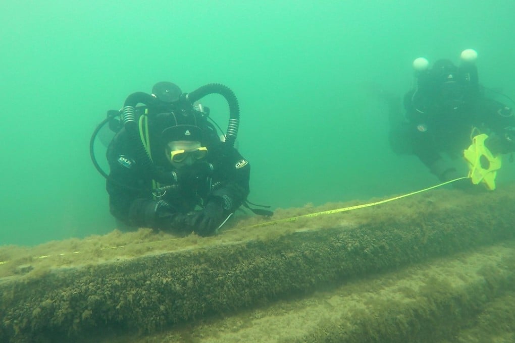 Maritime archaeologists and volunteers from the Wisconsin Historical Society measure the keelson during a survey in Lake Michigan near Port Washington, Wisconsin, at the underwater site of the J.M. Allmendinger, which sank in 1895 while carrying a load of timber. The site and dozens of other shipwrecks would be protected under a proposed national marine sanctuary for Lake Michigan. Photo: Chicago Tribune/TNS