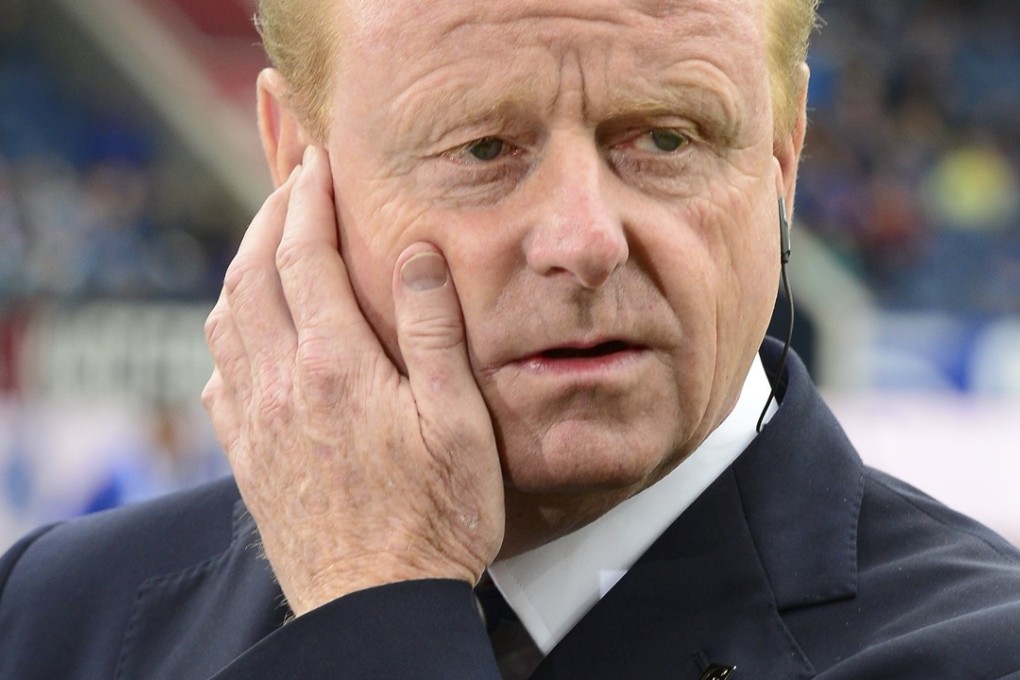 TV commentator Rolf Fringer, a former Swiss national coach, is nursing a sore face. Photo: EPA